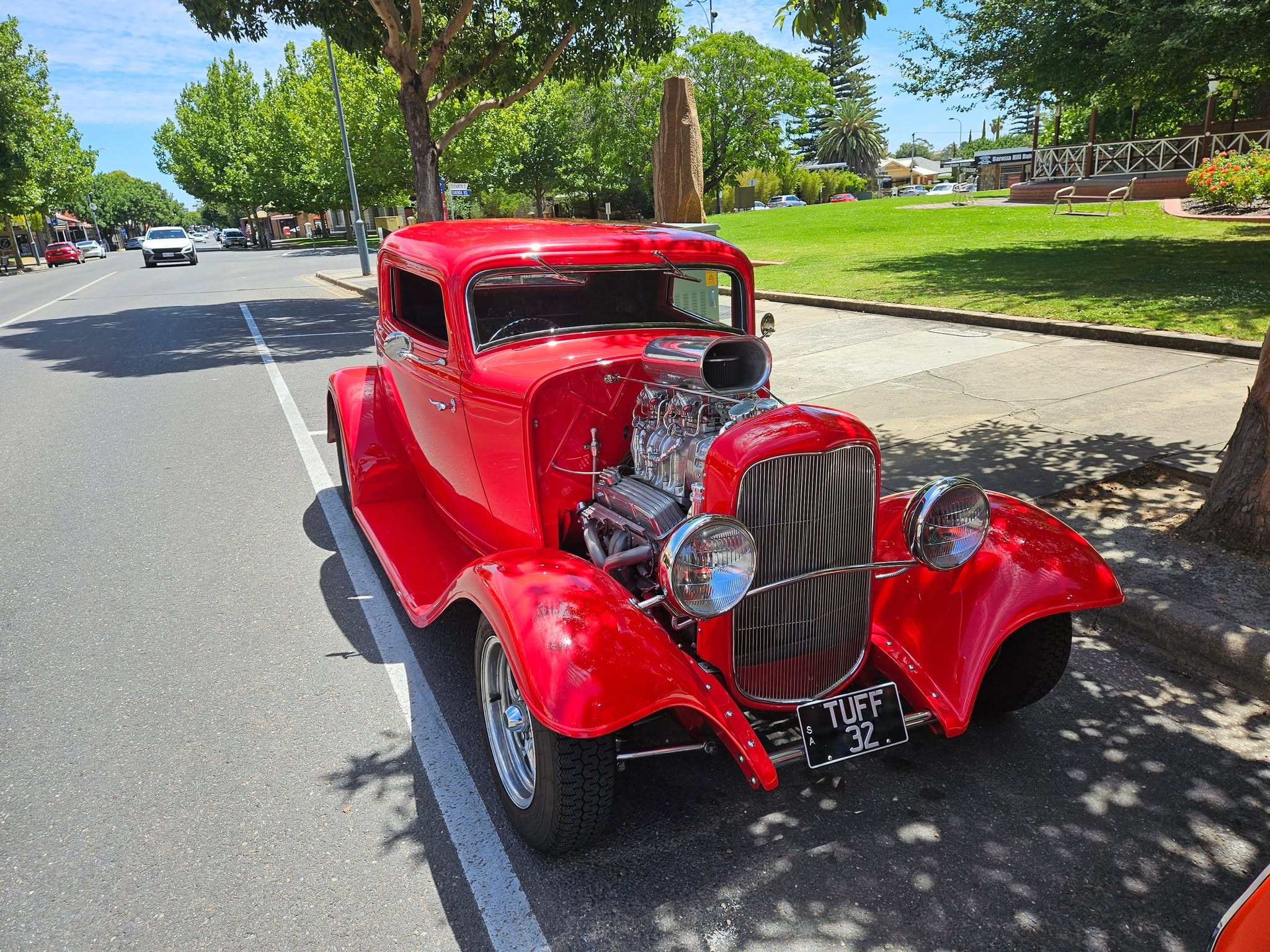 A classic car parked out the front of the diner